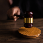 a wooden judge's block sitting on top of a wooden table