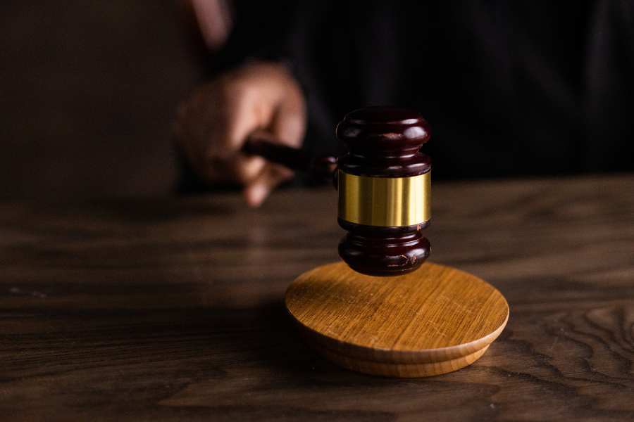 a wooden judge's block sitting on top of a wooden table