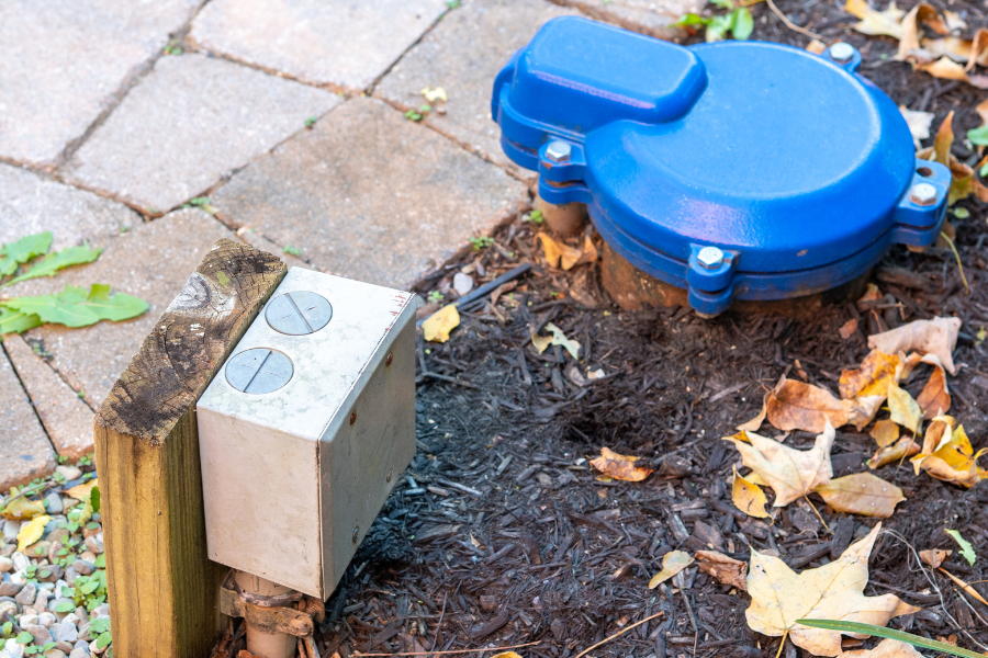 a blue fire hydrant sitting on top of a sidewalk